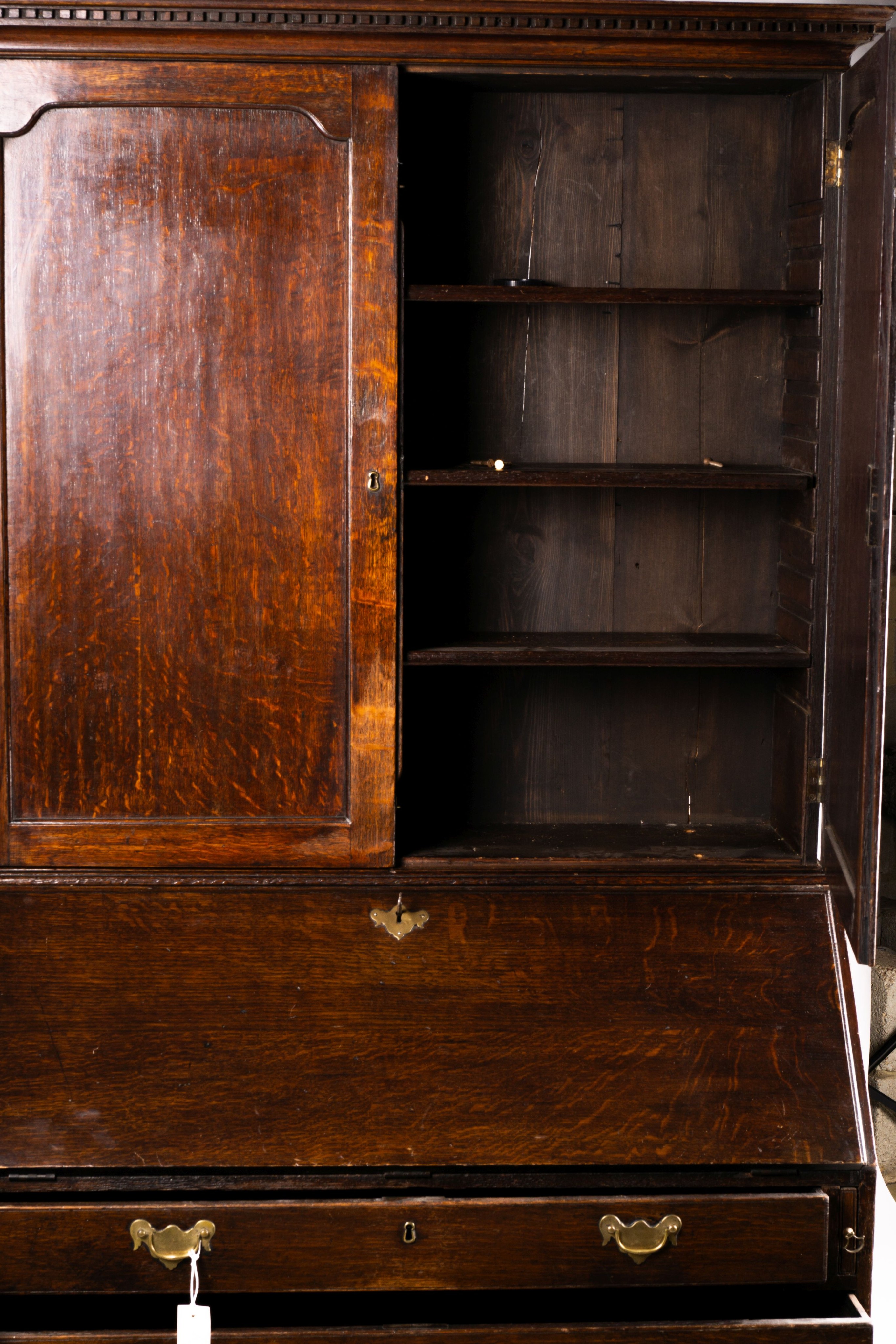 A George III oak bureau cabinet, width 108cm, depth 52cm, height 209cm